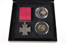 A VICTORIA CROSS GOLD AND SILVER COMMEMORATIVE SET, comprising a sterling silver crown, a 9 carat