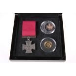 A VICTORIA CROSS GOLD AND SILVER COMMEMORATIVE SET, comprising a sterling silver crown, a 9 carat