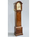 A MAPPIN & WEBB WALNUT THREE-TRAIN LONGCASE CLOCK, the thirteen inch break arch dial with switches