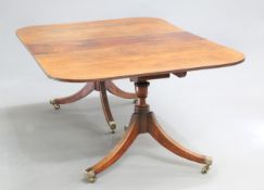 AN EARLY 19TH CENTURY MAHOGANY TWIN PEDESTAL DINING TABLE, the rectangular top with reeded edge,