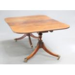 AN EARLY 19TH CENTURY MAHOGANY TWIN PEDESTAL DINING TABLE, the rectangular top with reeded edge,