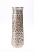 AN INDIAN SILVERED BRASS VASE, EARLY 20TH CENTURY, of tapering cylindrical form. 22cm