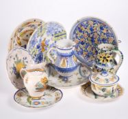A GROUP OF CONTINENTAL TIN-GLAZED EARTHENWARE, including puzzle jug, two-handled covered dish,