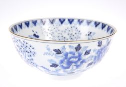 A CHINESE BLUE AND WHITE BOWL, circular, painted with foliage and butterflies. 15cm diameter