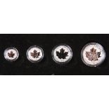 A ROYAL CANADIAN MINT PLATINUM ANNIVERSARY PRESTIGE COIN SET, comprising four platinum coins: 300