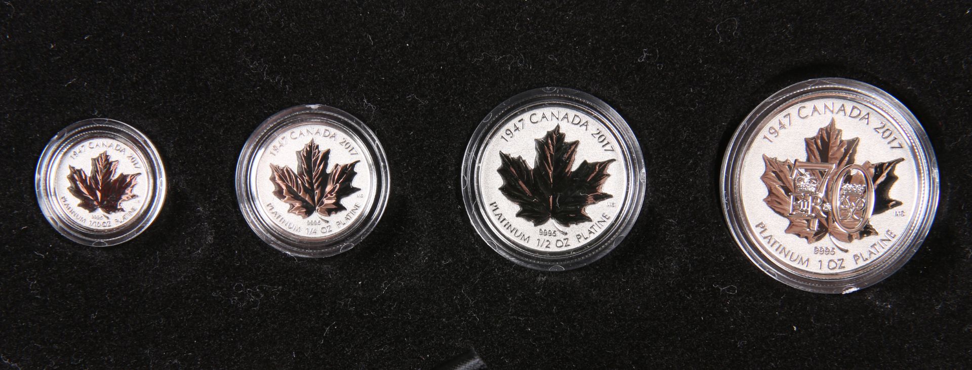 A ROYAL CANADIAN MINT PLATINUM ANNIVERSARY PRESTIGE COIN SET, comprising four platinum coins: 300