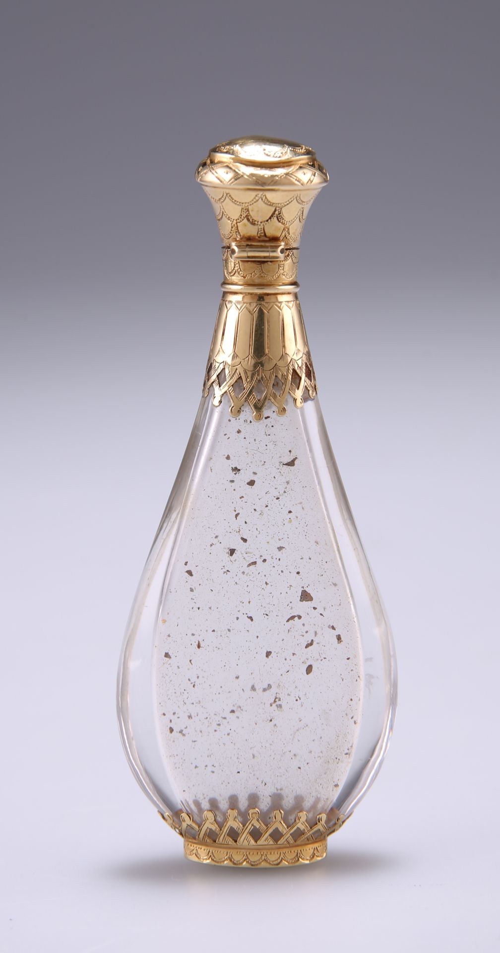 A MID 19TH CENTURY FRENCH GOLD MOUNTED ROCK CRYSTAL SCENT BOTTLE, of slim tapering oval form with