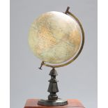 A FRENCH TERRESTRIAL GLOBE BY J FOREST, spinning on a brass meridian raised on a turned wooden base.