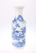 A CHINESE BLUE AND WHITE VASE, painted in the round with figures in a landscape, bears underglaze