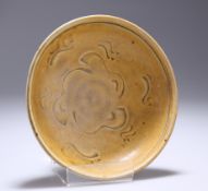 AN OCHRE-GLAZED STONEWARE BOWL, POSSIBLY KOREAN, circular, incised squiggle decoration. 16.5cm