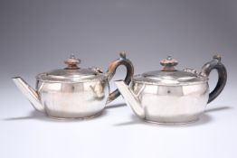 ^ A PAIR OF VICTORIAN SILVER BACHELOR'S TEAPOTS, by Stephen Smith, London 1885, squat circular form,