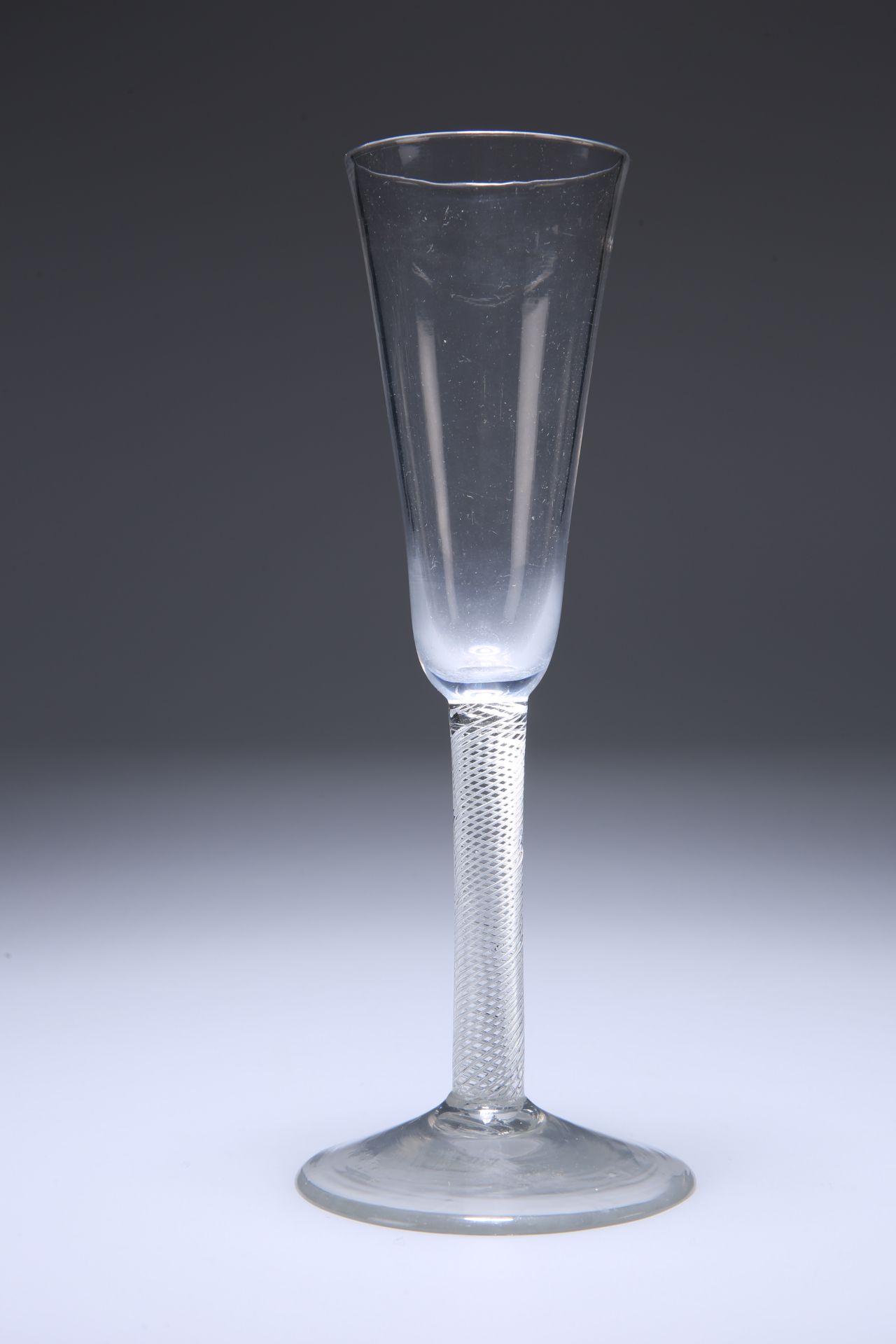 A TALL ALE GLASS, MID-18TH CENTURY, with drawn trumpet bowl