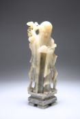 A CHINESE SOAPSTONE FIGURE