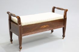AN EDWARDIAN INLAID DUET STOOL, the box seat with upholstered hinged lid, the front inlaid with a