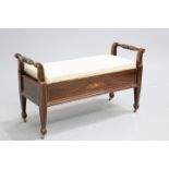 AN EDWARDIAN INLAID DUET STOOL, the box seat with upholstered hinged lid, the front inlaid with a