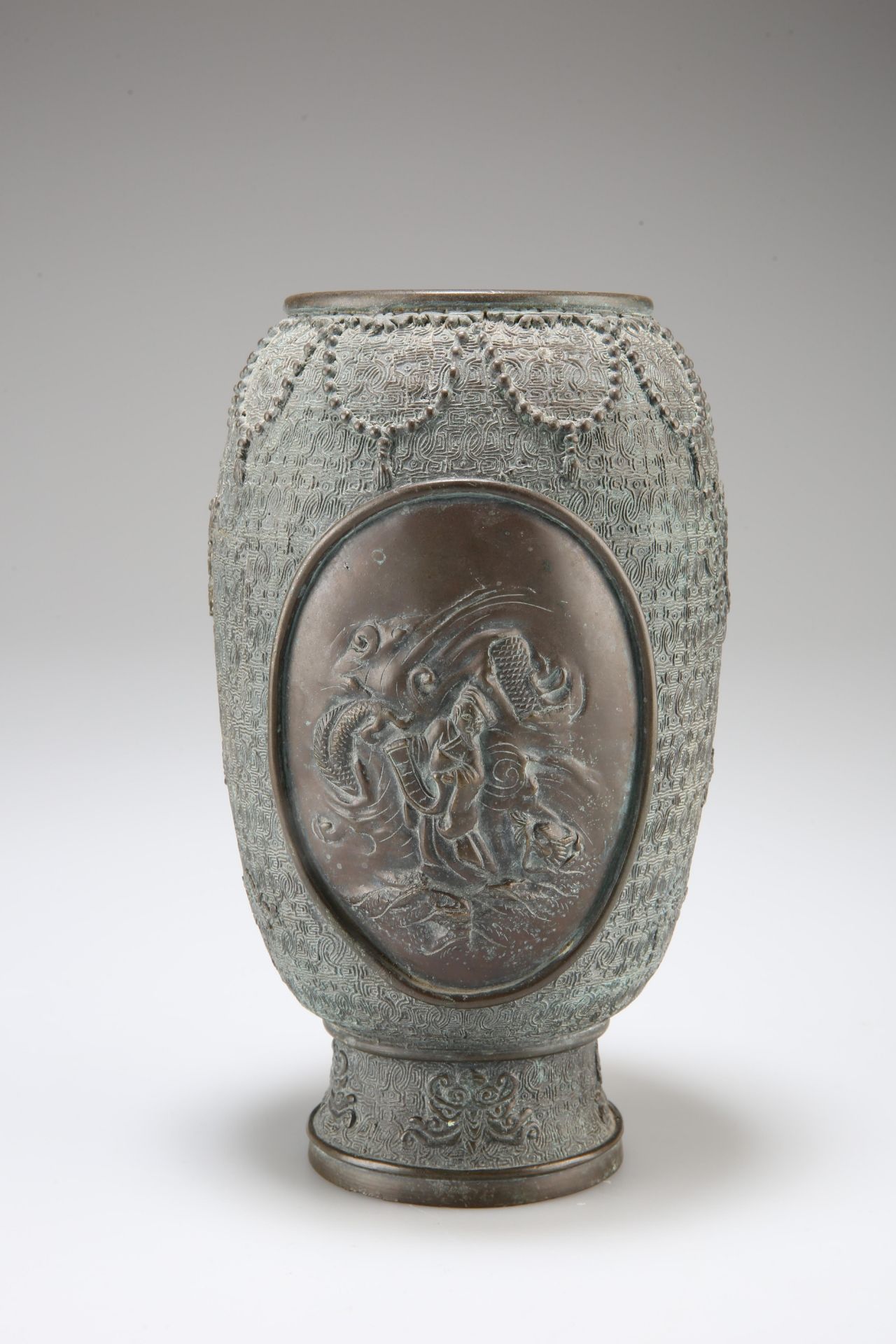 A JAPANESE BRONZE VASE, CIRCA 1900, of ovoid form, the front cast with an oval panel depicting a