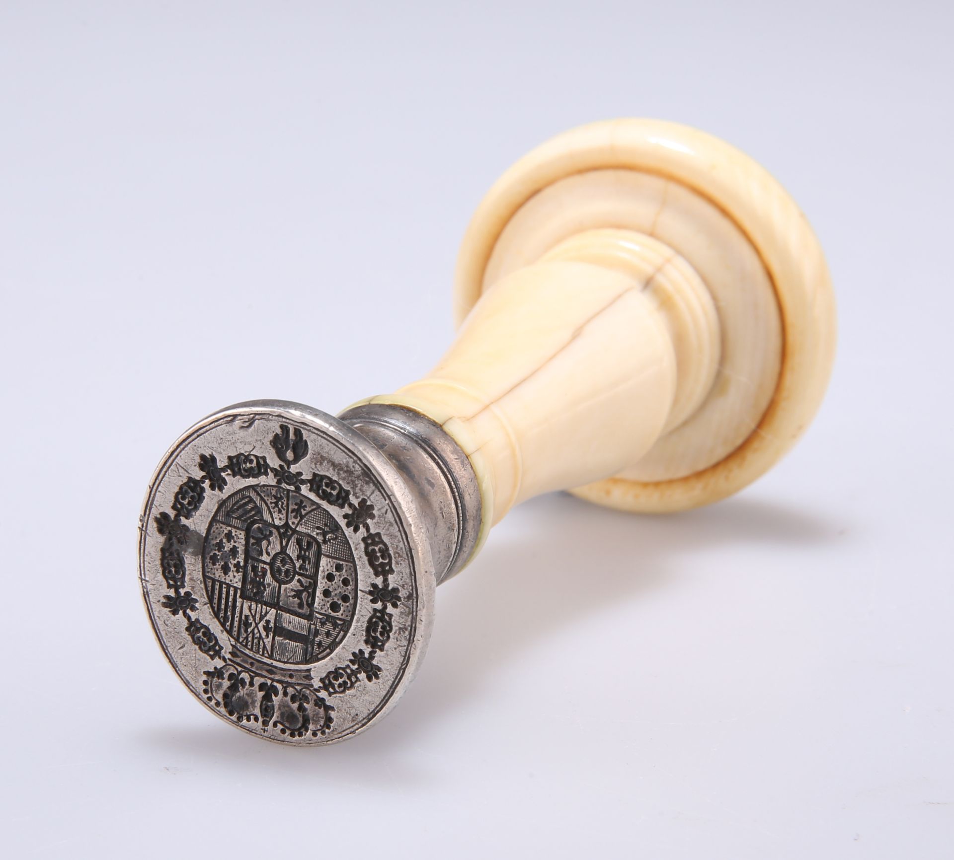 A 19TH CENTURY IVORY-HANDLED SEAL, the white-metal matrix with Royal Coat of Arms of Spain with