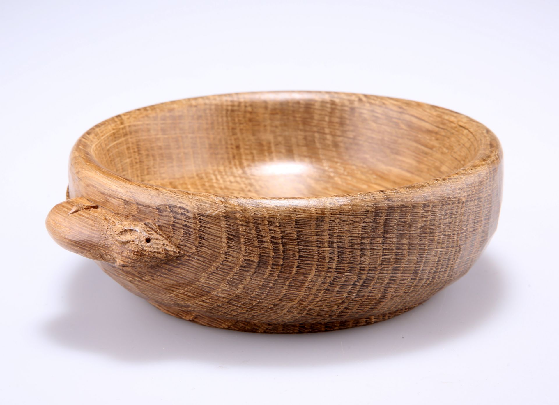 ROBERT THOMPSON OF KILBURN A MOUSEMAN OAK NUT DISH, circular, adzed exterior, carved mouse