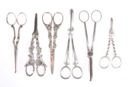A GROUP OF SIX PAIRS OF SILVER-PLATED GRAPE SCISSORS. (6)