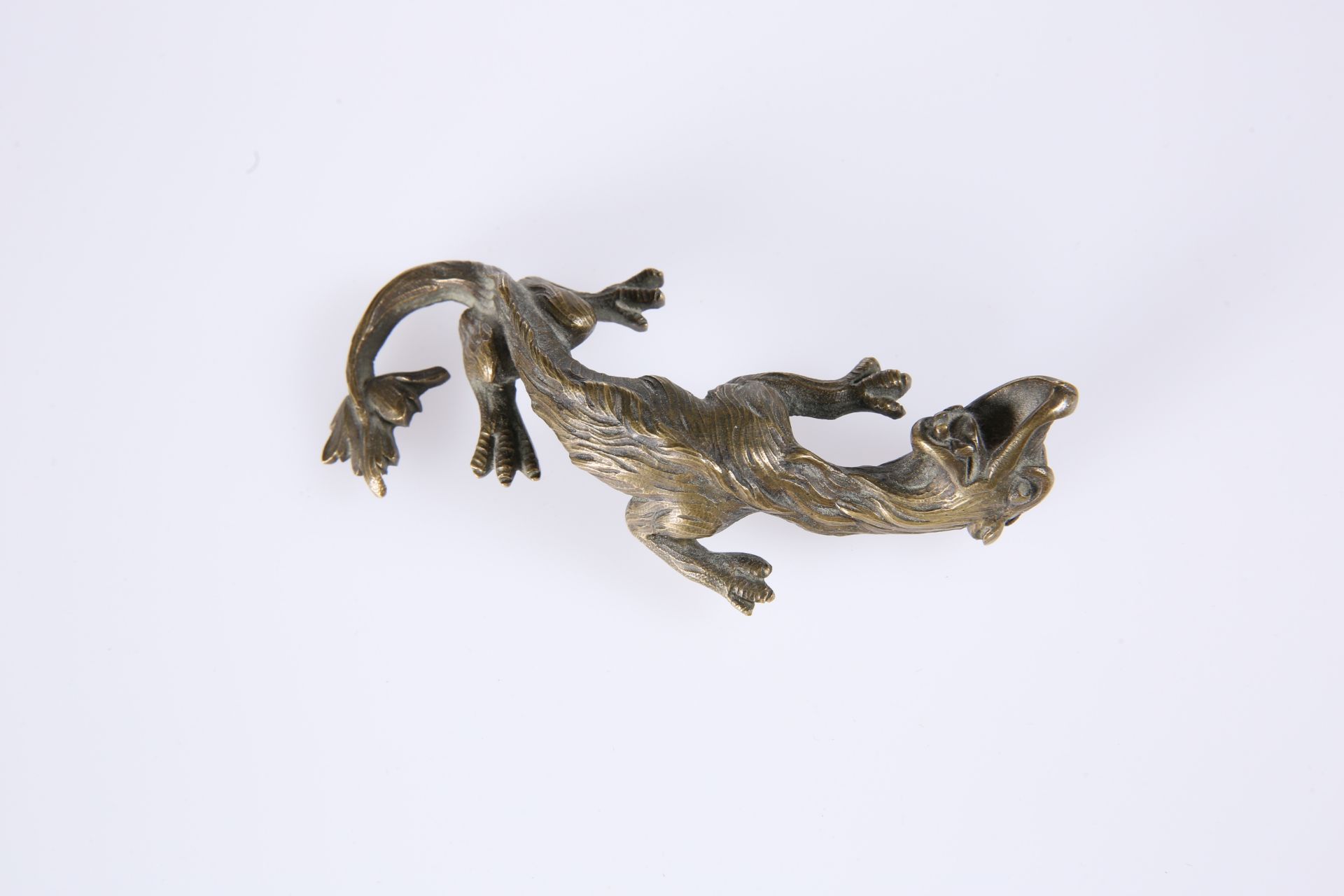AN UNUSUAL BRONZE OF A DRAGON, with up-twisted head, 19th Century