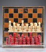 ~ A CALVERT IVORY AND STAINED IVORY CHESS SET, 19TH CENTURY, lacking a white pawn, two white rooks