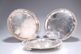 ^ A SET OF THREE GEORGE IV SILVER WAITERS, by John Bridge, London 1824, circular with gadrooned rims
