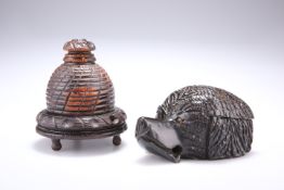 TREEN: A 19TH CENTURY CARVED INKWELL, in the form of a dog's head, 10.9cm back to front; together