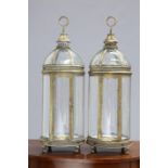 A PAIR OF PERIOD STYLE GILT METAL HANGING LANTERNS, each with domed top and hinged door. 78cm high