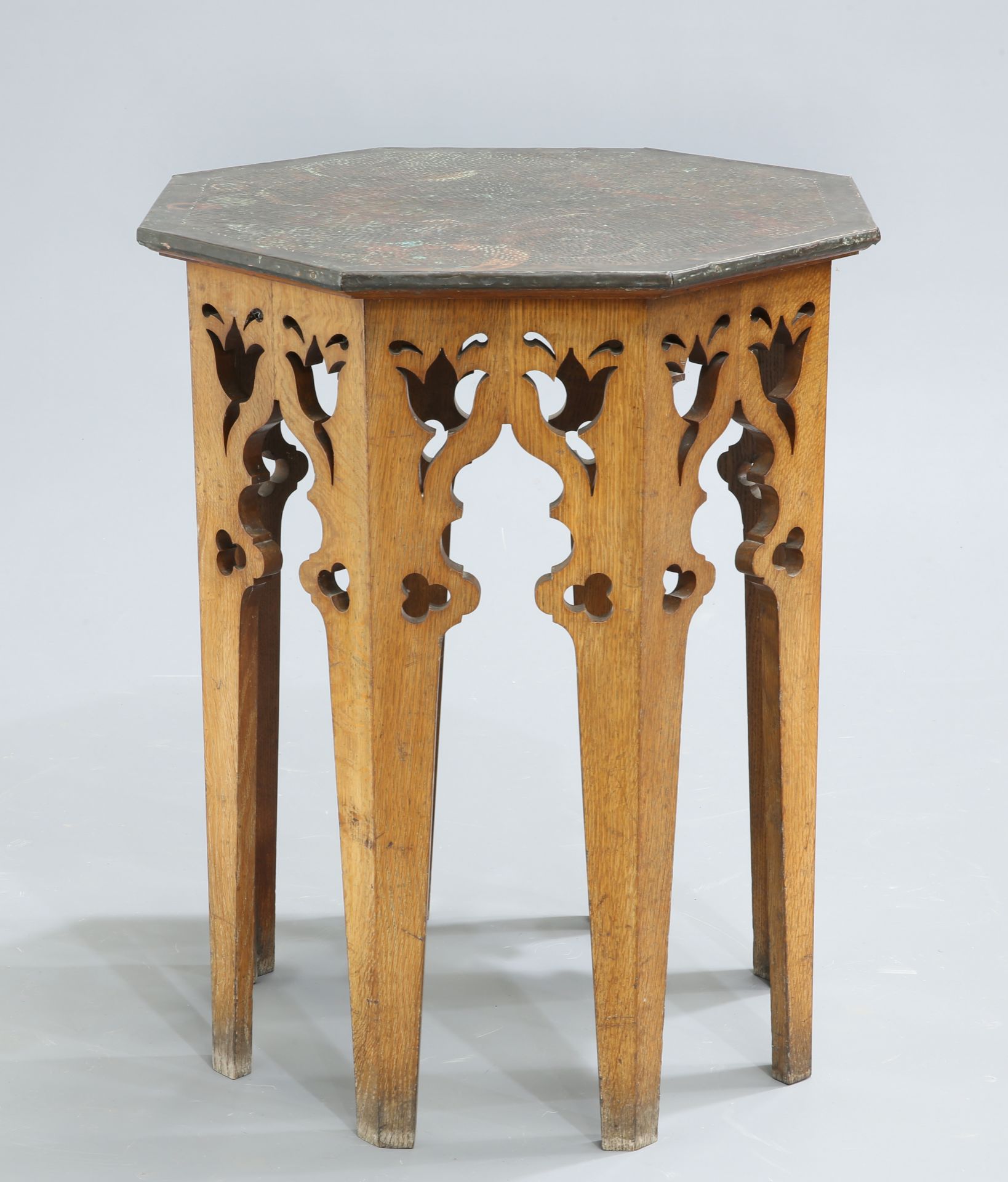 AN ARTS AND CRAFTS OAK AND COPPER OCCASIONAL TABLE, with octagonal copper top. 74cm high, 58cm