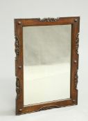 A 1920'S OAK MIRROR, rectangular, carved and pierced with scrolling foliage. 87cm by 62cm