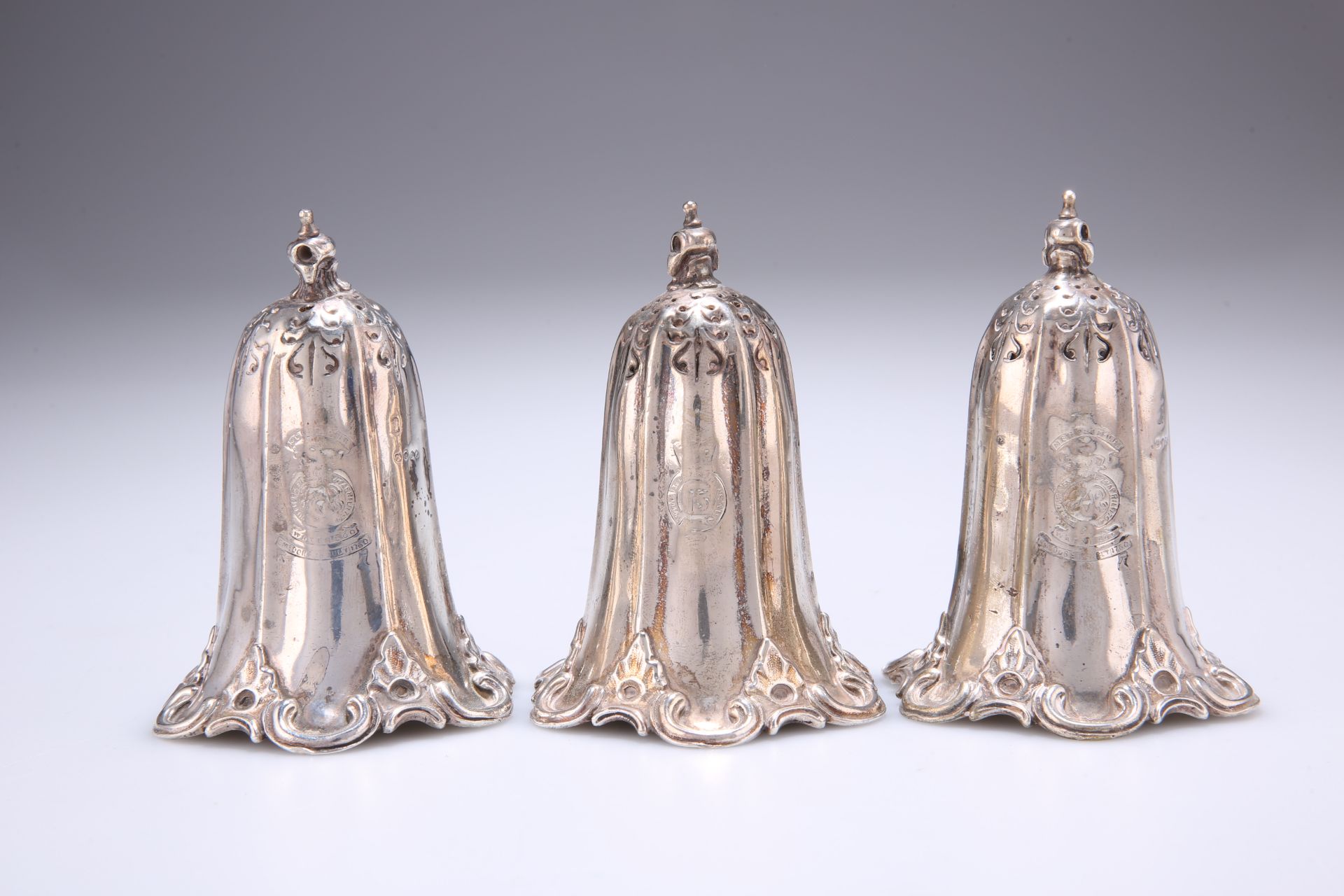 ^ A SET OF THREE VICTORIAN SILVER PEPPER POTS, by Stephen Smith & William Nicholson, London 1856,