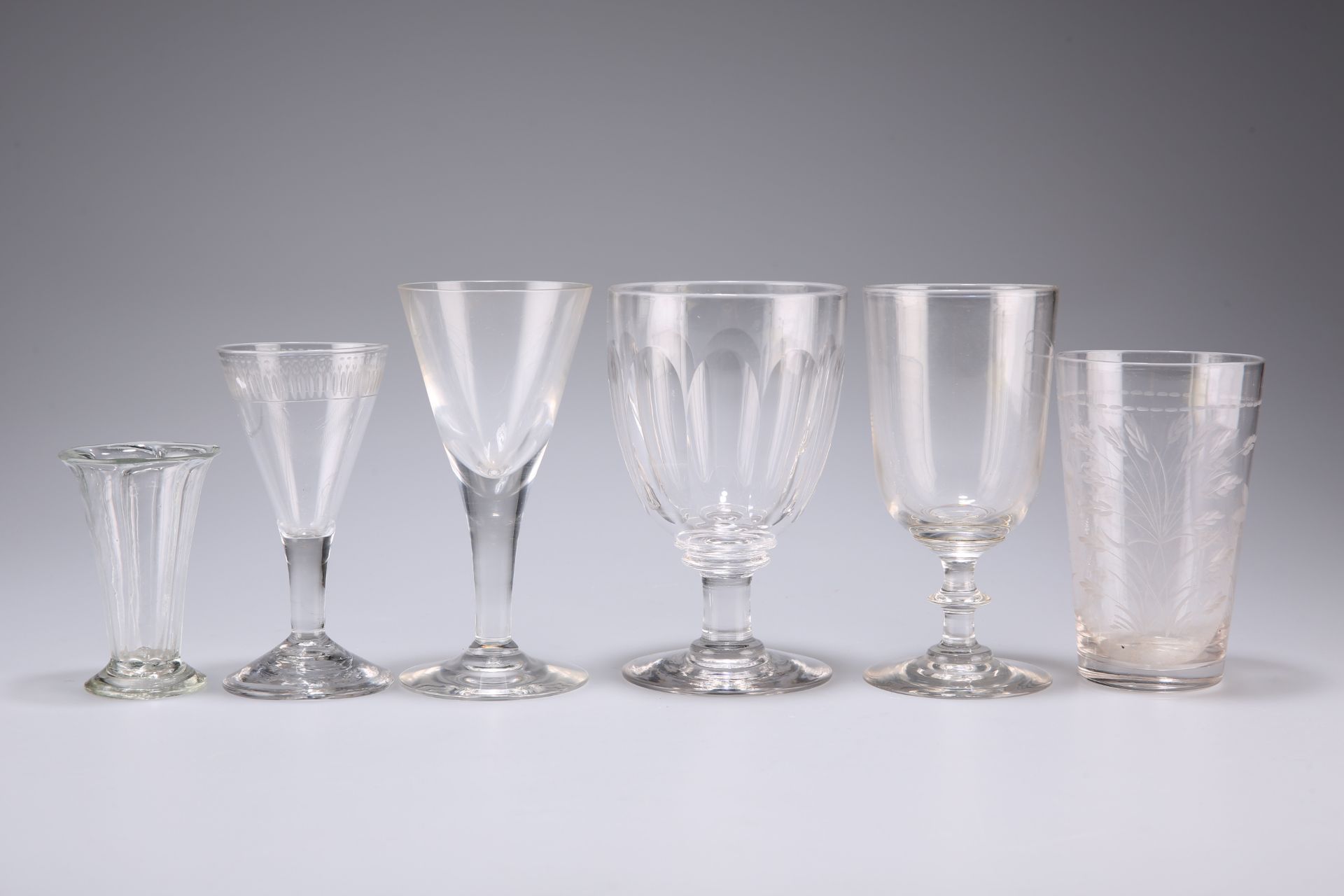 A LARGE GROUP OF GEORGIAN AND LATER DRINKING GLASSES, including slice-cut rummers, jellies, wines,