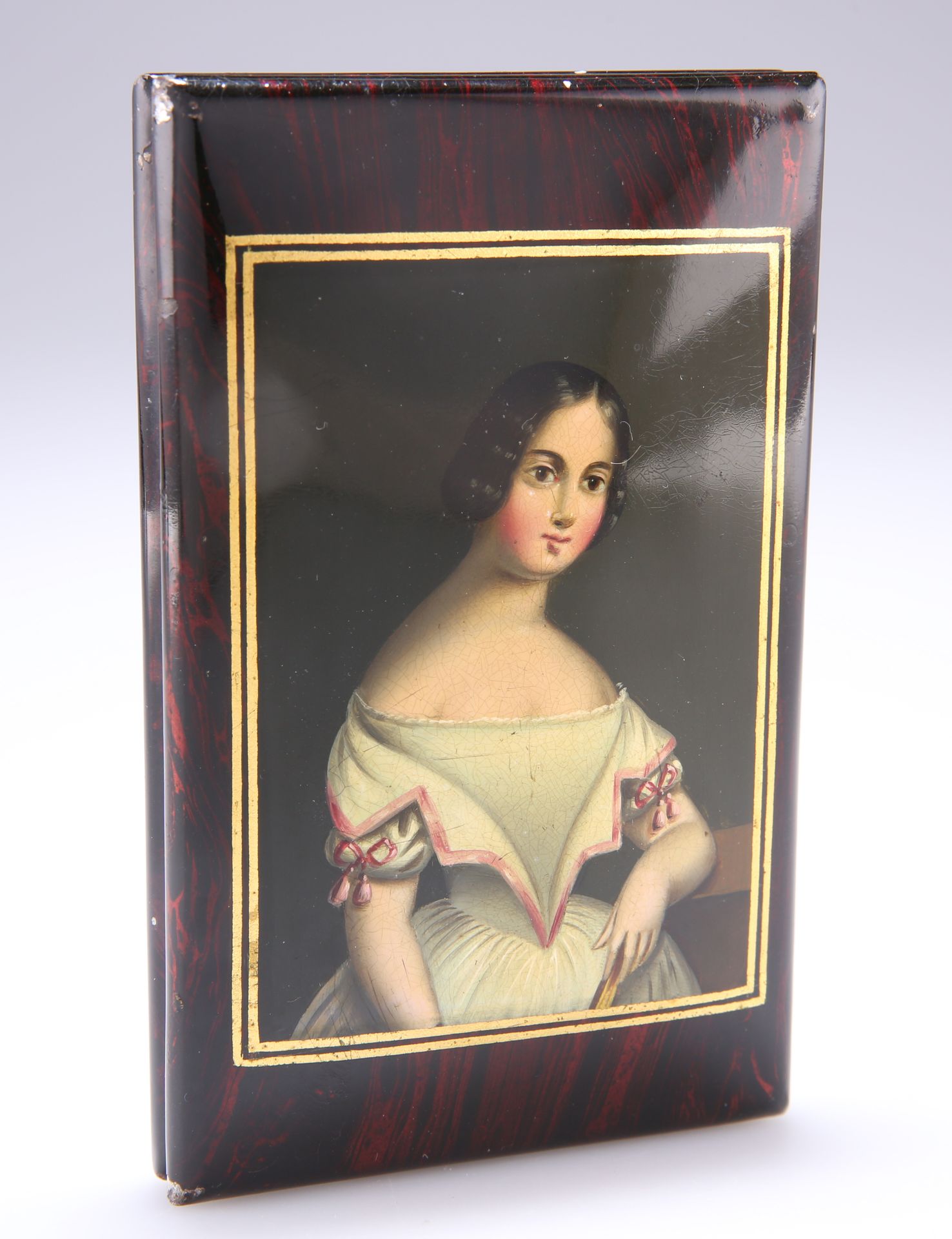 A 19TH CENTURY LACQUERED TIN CIGARETTE CASE, IN STOBWASSER STYLE, cushioned rectangular form, the