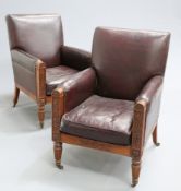 ~ A PAIR OF MAHOGANY AND LEATHER UPHOLSTERED LIBRARY BERGERES, FIRST HALF 19TH CENTURY, each with