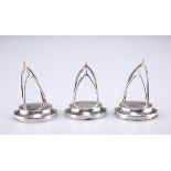 A SET OF THREE GEORGE V SILVER MENU HOLDERS, by George Unite & Sons, two Chester 1910, the third