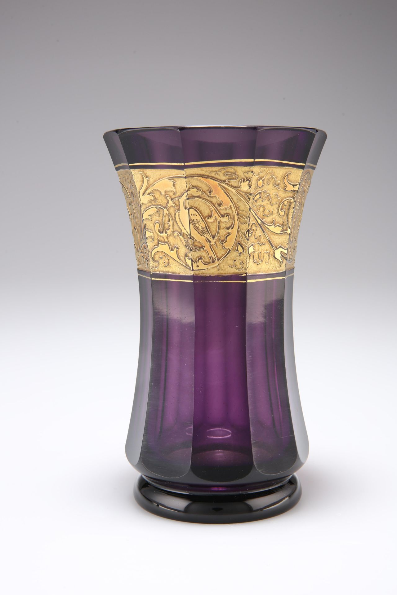 A MOSER AMTHEYST GLASS VASE, 1920'S, of faceted waisted form, with gilt oroplastic birds and foliage