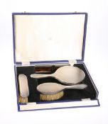 AN ELIZABETH II SILVER FOUR PIECE DRESSING TABLE SET, London 1964, comprising two brushes, mirror