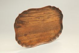 A GEORGIAN STYLE MAHOGANY TRAY, cartouche-shaped with moulded edge. 53cm by 40.5cm