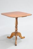 A VICTORIAN MAHOGANY TRIPOD TABLE, the rectangular top with rounded corners, raised on a baluster