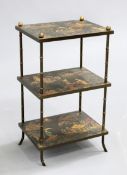 A CHINOISERIE THREE TIER ETAGERE, the three shelves supported on bamboo-form metal supports. 70cm