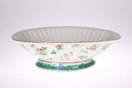 A 19TH CENTURY CHINESE FAMILLE ROSE BOWL, ribbed shaped-oval form, the exterior painted with insects