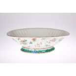 A 19TH CENTURY CHINESE FAMILLE ROSE BOWL, ribbed shaped-oval form, the exterior painted with insects