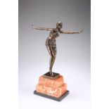 AN ART DECO STYLE BRONZE FIGURE OF A DANCER, in Ballet Russe costume, posing with arms