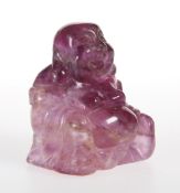 A CHINESE AMETHYST FIGURE OF A BUDDHA, 19TH CENTURY, carved seated with hands resting on knees,