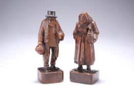 TREEN: A PAIR OF 19TH CENTURY OAK FIGURES, carved as a man and woman, she stands holding a basket