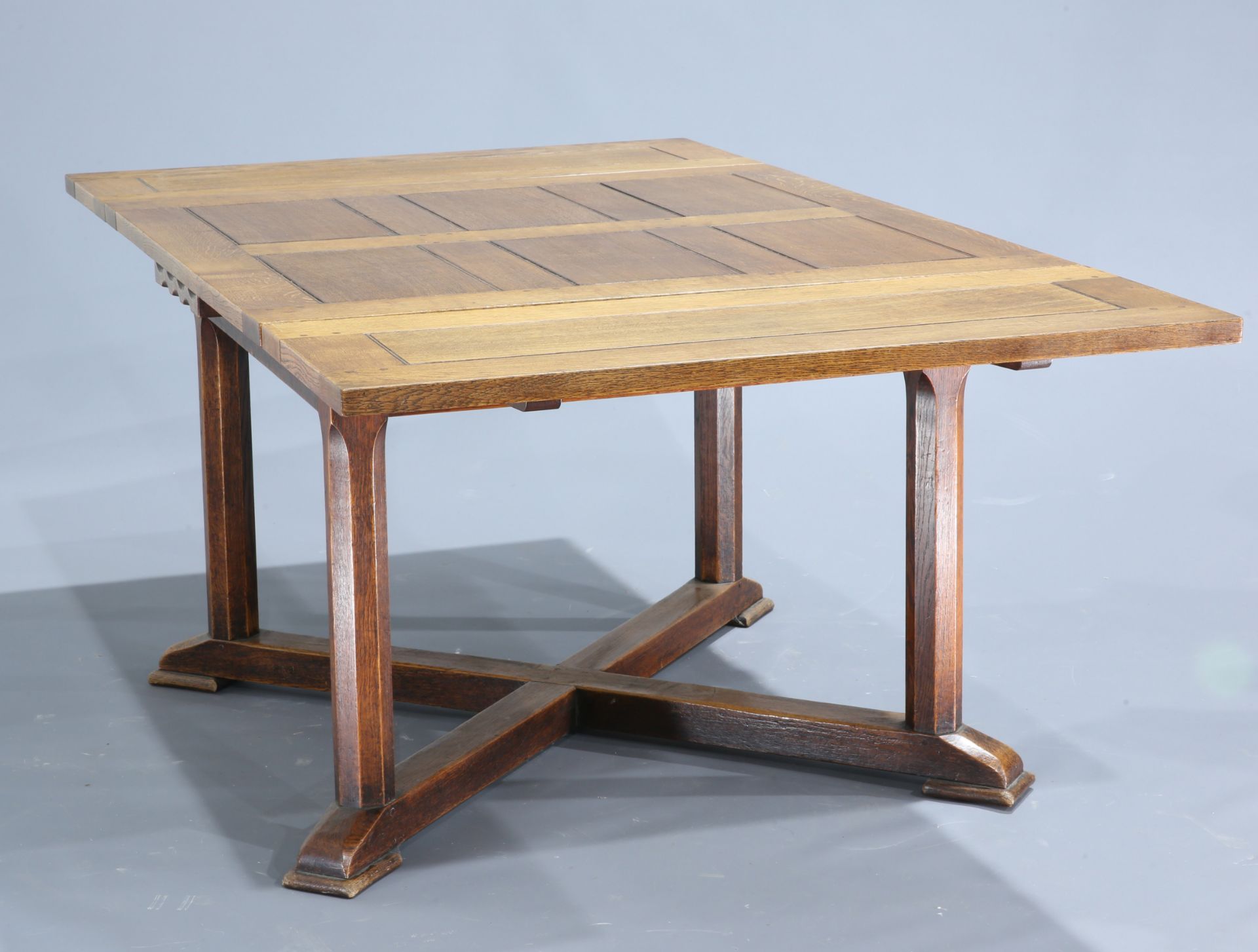 STANLEY WEBB DAVIES (1894-1978) A RARE OAK EXTENDING DINING TABLE, 1929, the rectangular panelled