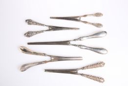 FIVE PAIRS OF VICTORIAN AND EDWARDIAN SILVER HANDLED GLOVE STRETCHERS, each with stainless steel