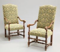 A PAIR OF FRENCH OAK AND UPHOLSTERED OPEN ARMCHAIRS, each with upholstered back above a stuffed over