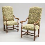 A PAIR OF FRENCH OAK AND UPHOLSTERED OPEN ARMCHAIRS, each with upholstered back above a stuffed over