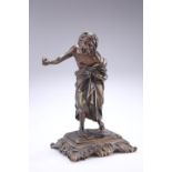 A 19TH CENTURY BRONZE FIGURE, cast as a peasant clutching his robes and with an arm outstretched.